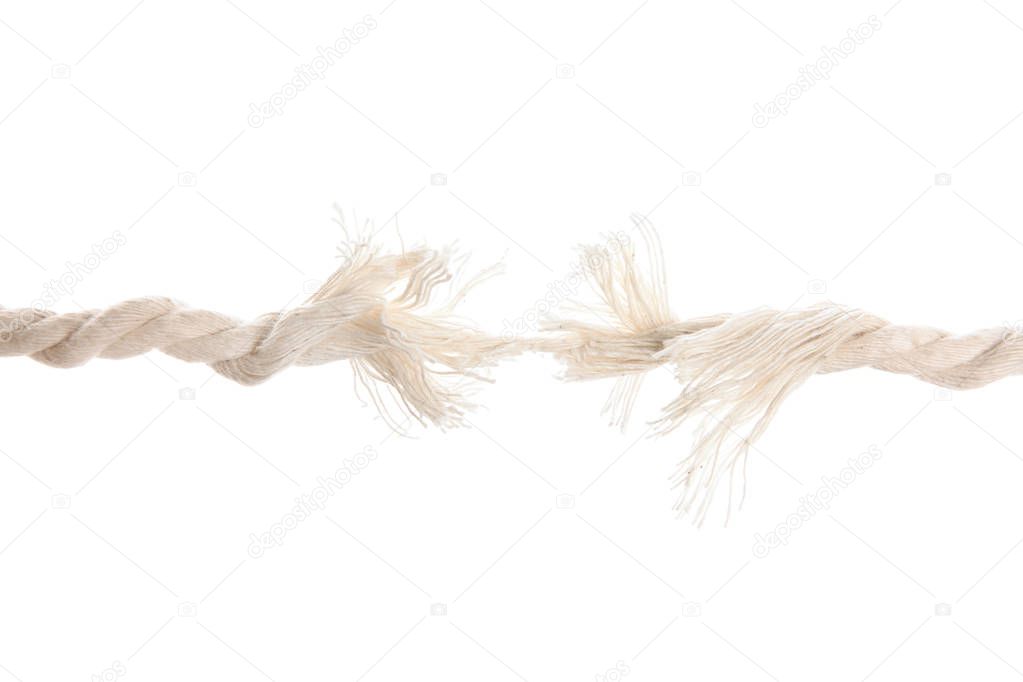 Frayed rope at breaking point on white background