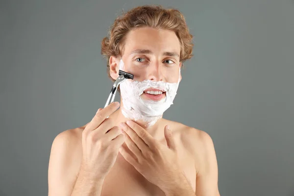 Handsome Young Man Shaving Gray Background — Stock Photo, Image