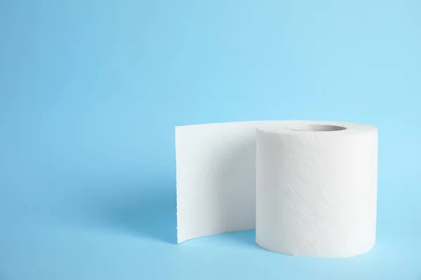 Toilet paper roll on color background. Space for text