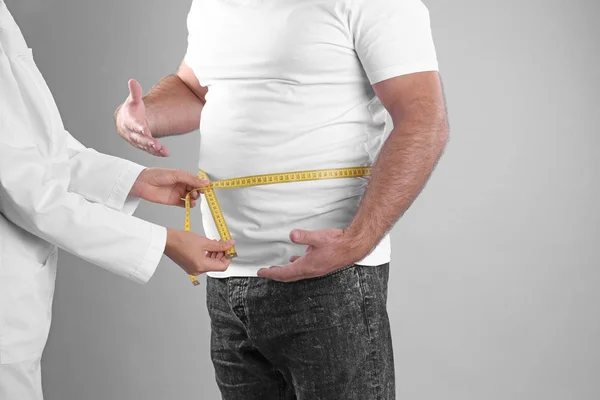 Doctor Measuring Fat Man Waist Grey Background Weight Loss — Stock Photo, Image