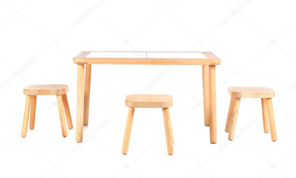 Small table and chairs for little kids on white background