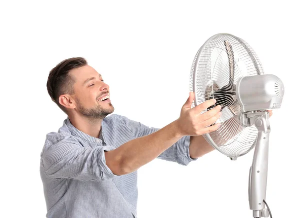 Hombre Refrescante Del Calor Delante Del Ventilador Sobre Fondo Blanco —  Fotos de Stock