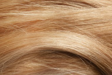 Arka plan, closeup olarak sağlıklı sarışın saç dokusuna