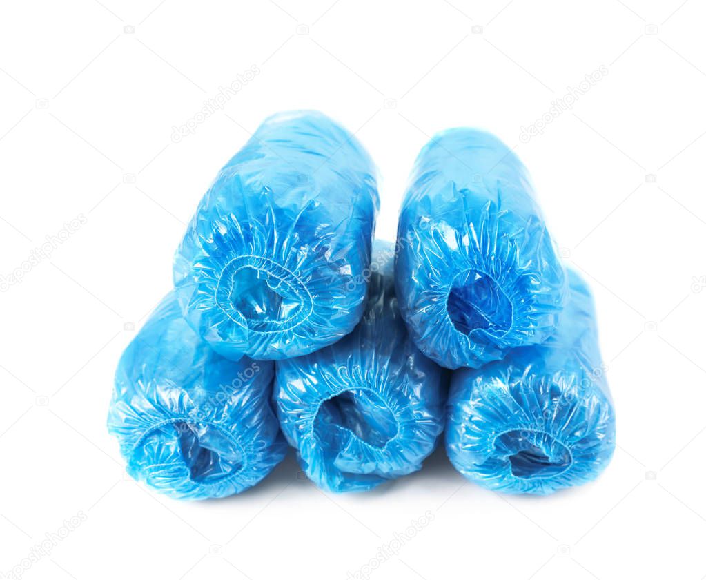 Medical blue shoe covers on white background