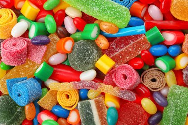 Pile of delicious colorful chewing candies as background clipart