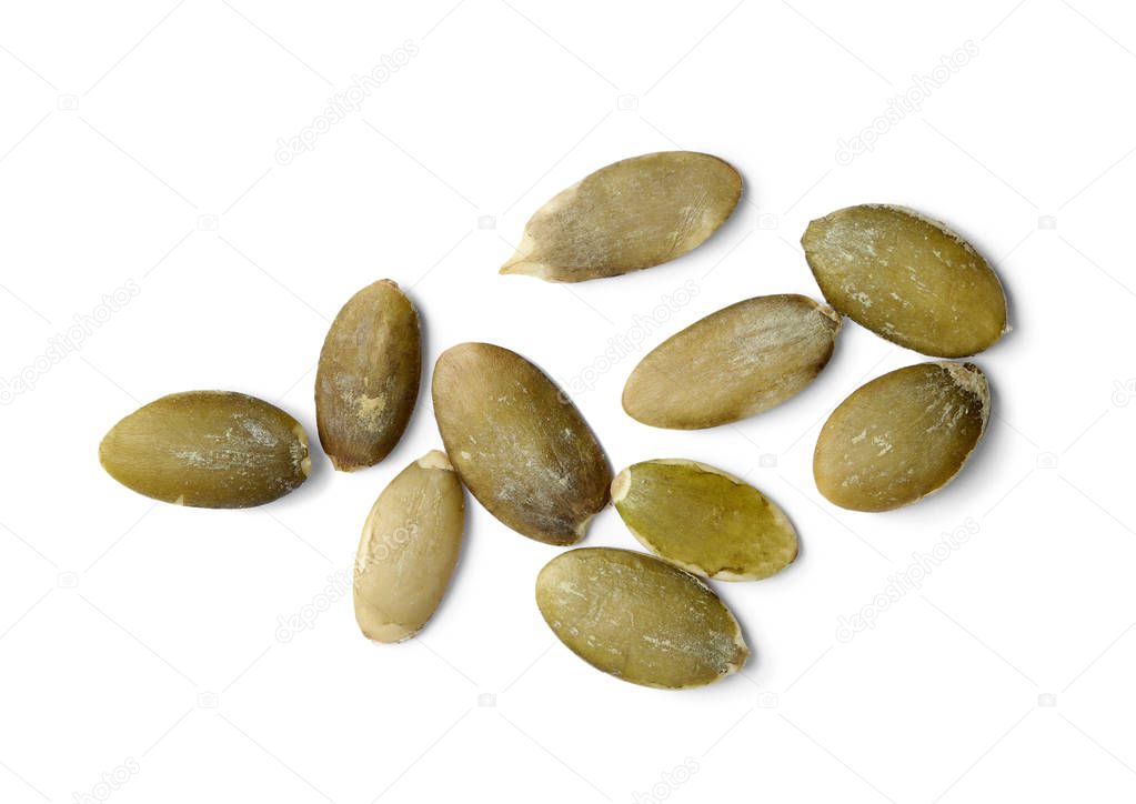 Raw pumpkin seeds on white background, top view