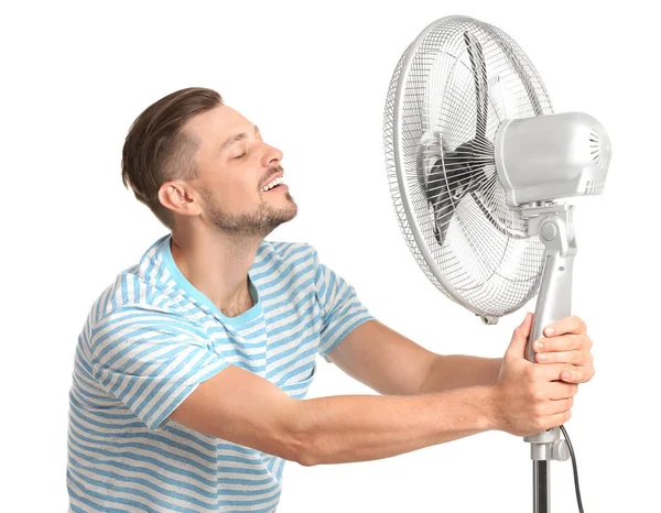 Hombre Refrescante Del Calor Delante Del Ventilador Sobre Fondo Blanco —  Fotos de Stock