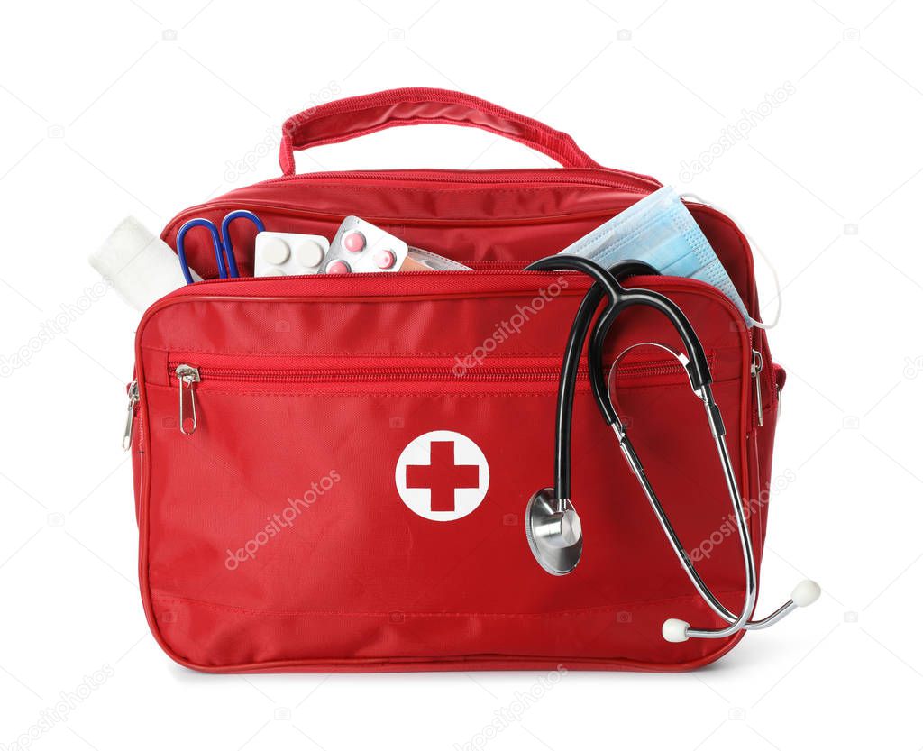 First aid kit with stethoscope on white background