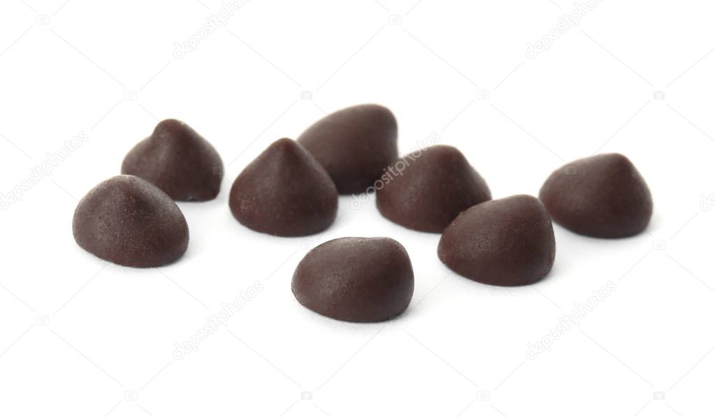 Delicious dark chocolate chips on white background