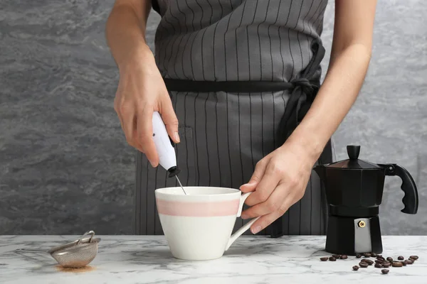 Woman Using Milk Frother Cup Table — Stock Photo, Image