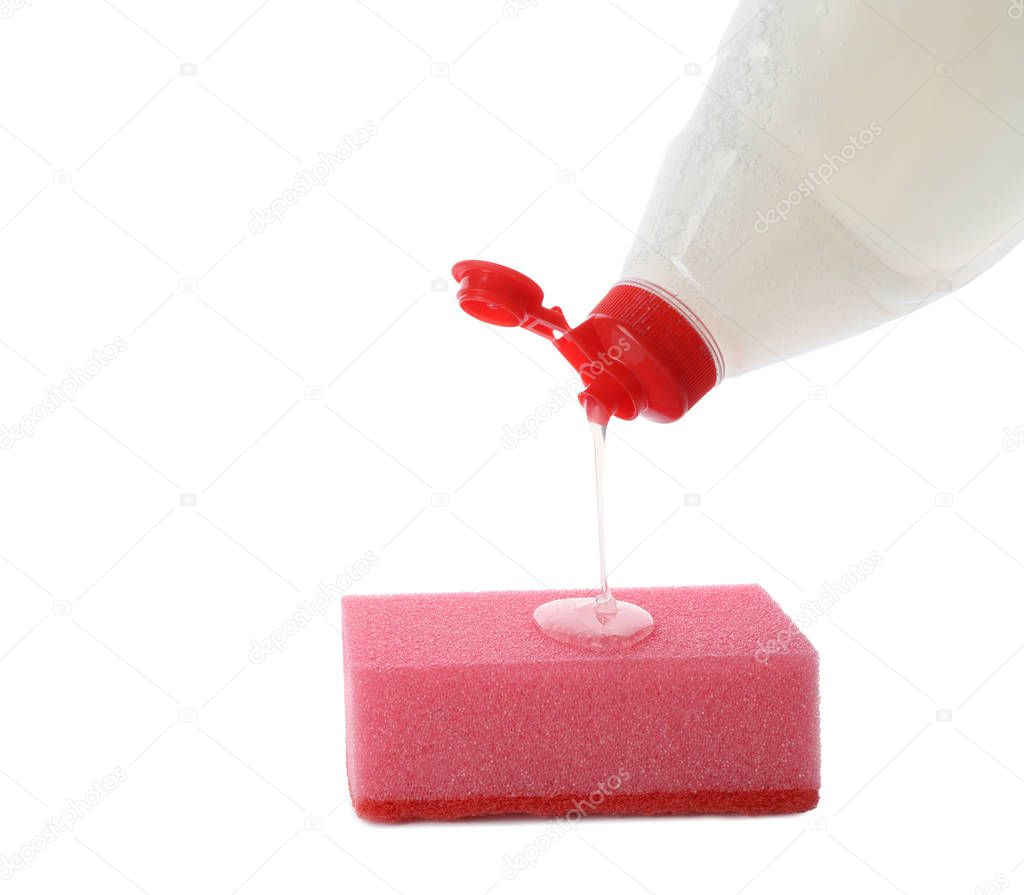 Pouring cleaning product for dish washing onto sponge on white background