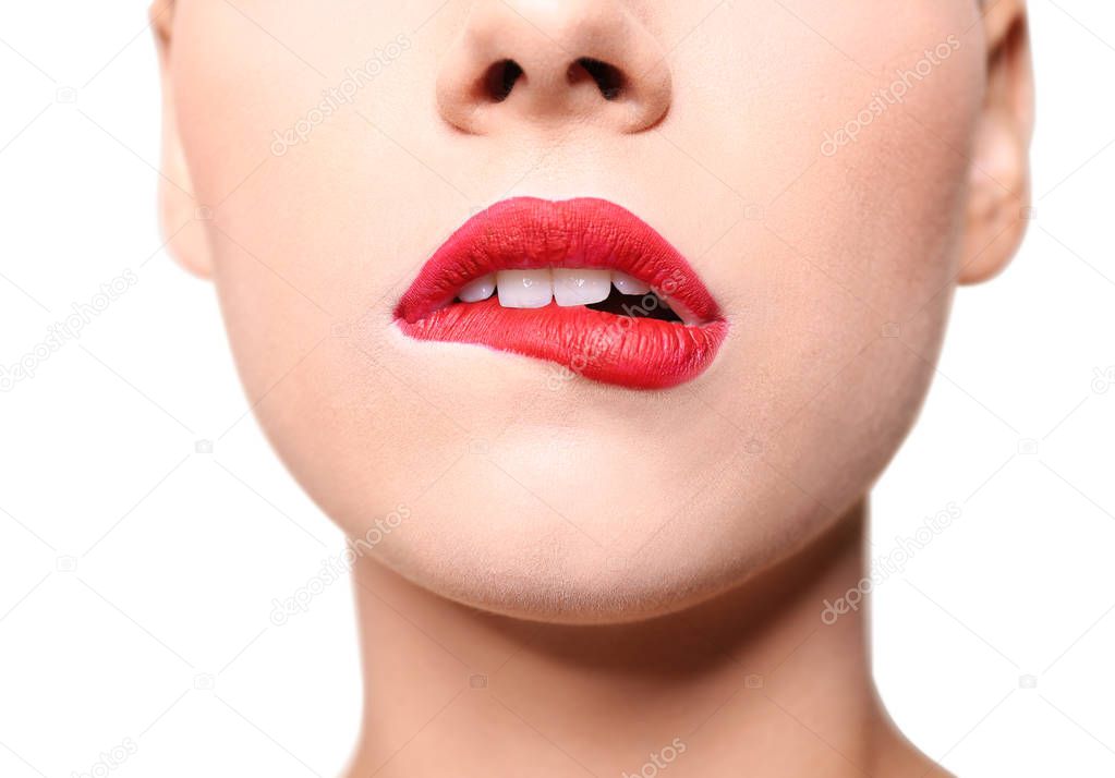 Beautiful young woman with red lips on color background, closeup