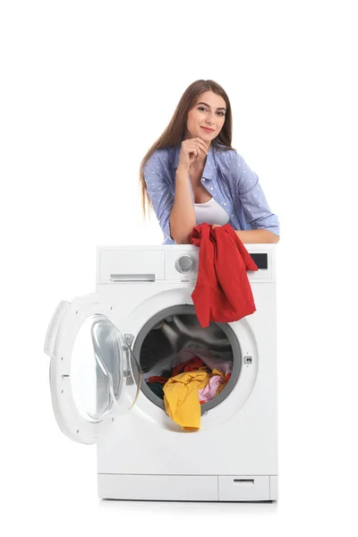 Young Woman Loading Washing Machine Dirty Laundry White Background — Stock Photo, Image