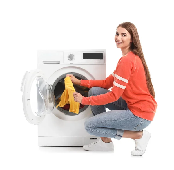 Young Woman Taking Laundry Out Washing Machine White Background — Stock Photo, Image