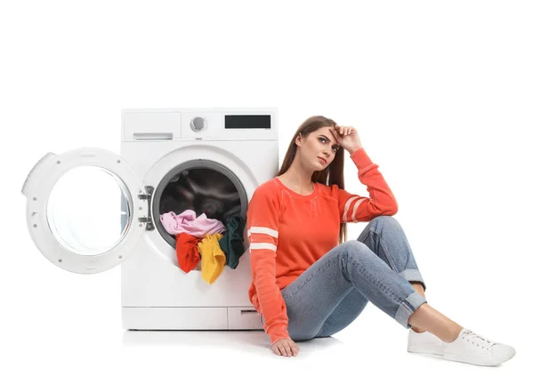 Young Woman Sitting Washing Machine Dirty Laundry White Background — Stock Photo, Image