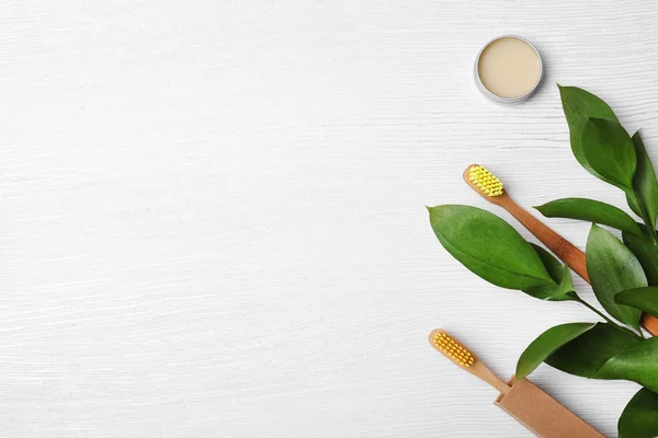 Flat Lay Composition Bamboo Toothbrushes Space Text White Wooden Background — Stock Photo, Image