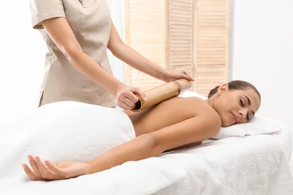 Young Woman Having Massage Bamboo Stick Wellness Center — Stock Photo, Image