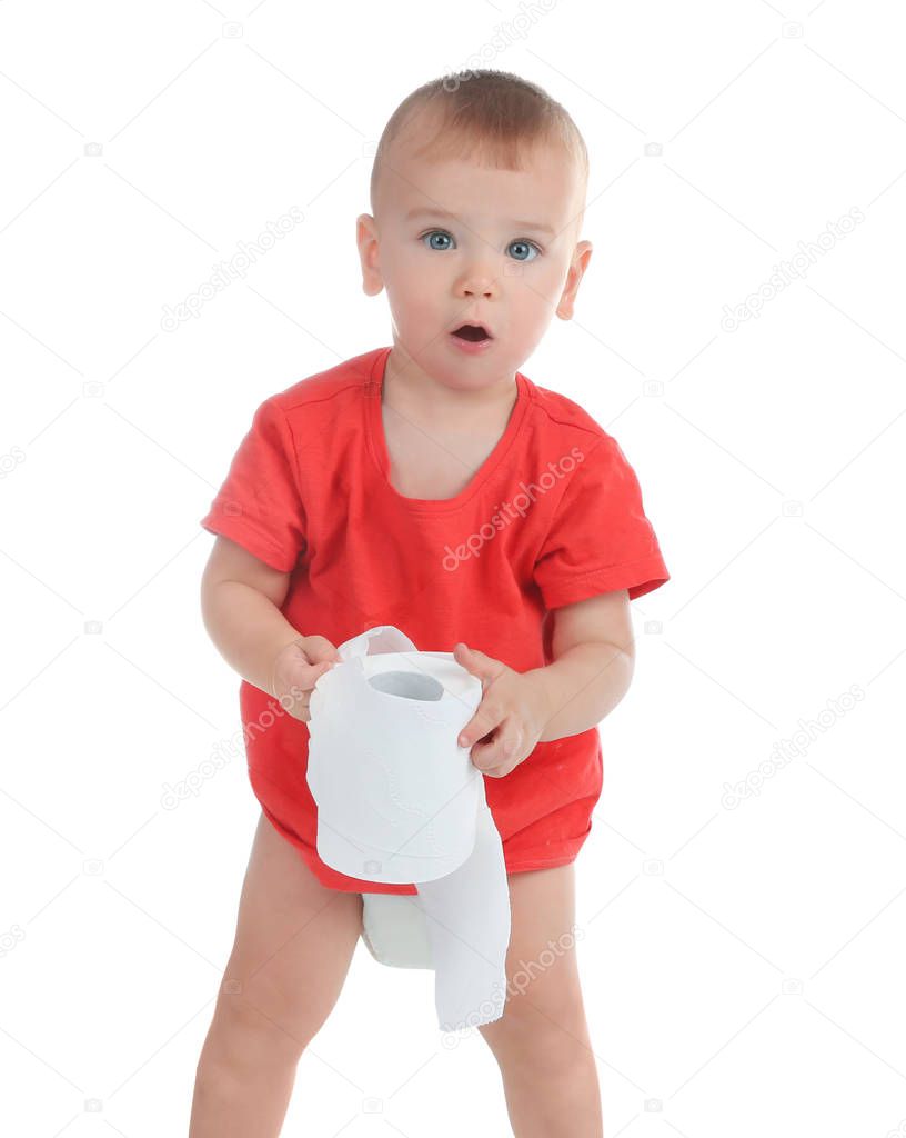 Cute toddler playing with toilet paper on white background