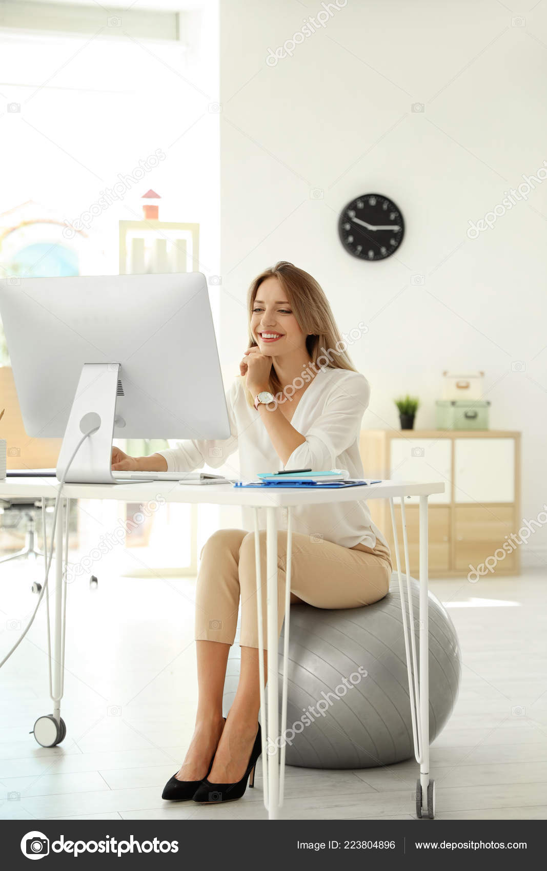 Young Businesswoman Sitting Fitness Ball Using Computer Office