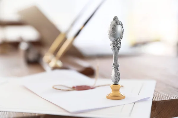 Vintage notary stamp and documents on desk with space for text, closeup