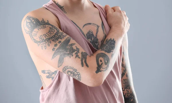 Young Man Stylish Tattoos Grey Background — Stock Photo, Image
