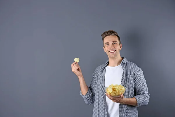 Man Bowl Potato Chips Grey Background Space Text — Stock Photo, Image