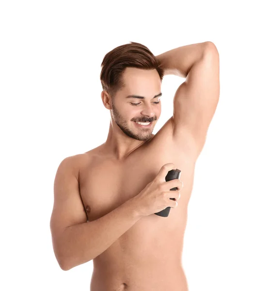 Ung Man Använder Deodorant Vit Bakgrund — Stockfoto