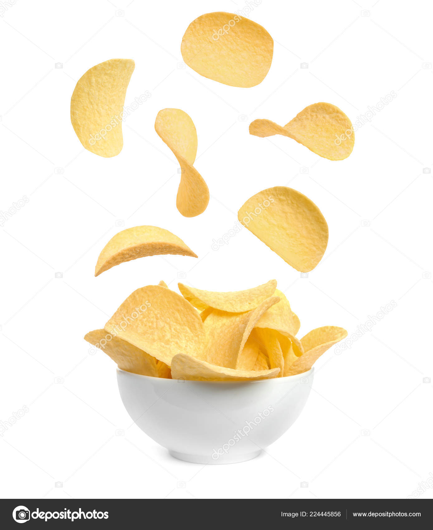 Tasty Potato Chips Falling Blow White Background Stock Photo by