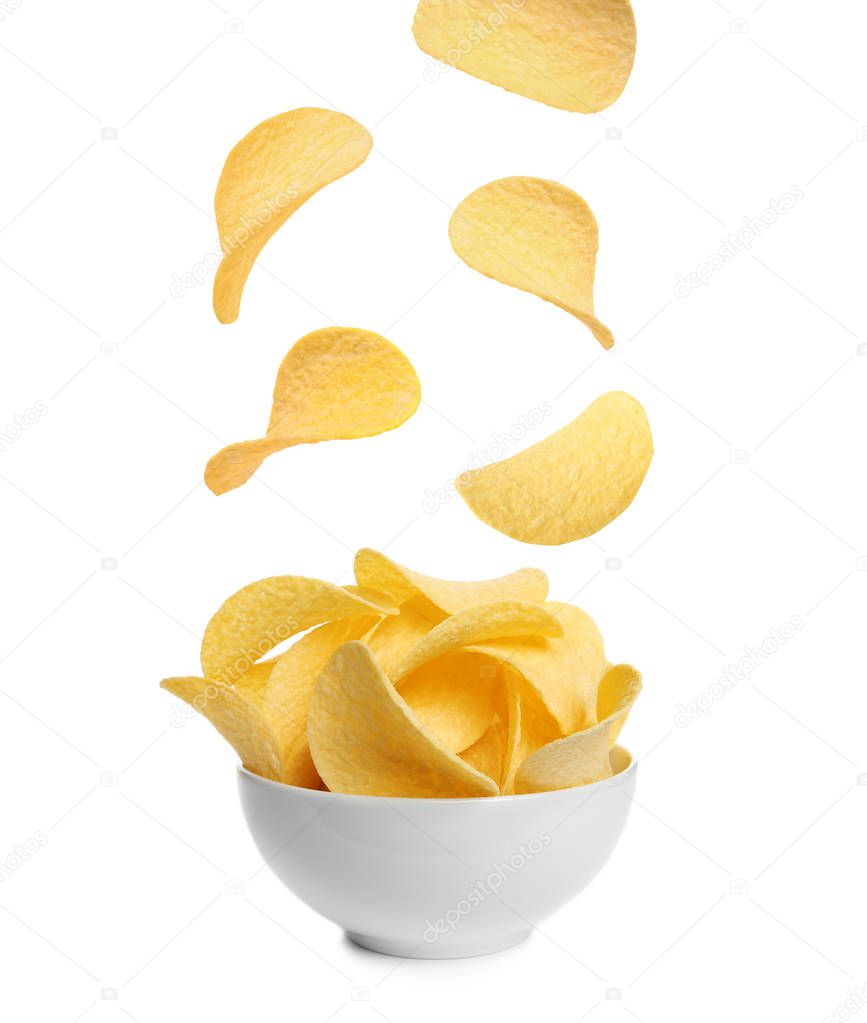 Tasty potato chips falling into blow on white background