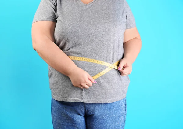 Overweight Woman Measuring Waist Weight Loss Color Background — Stock Photo, Image