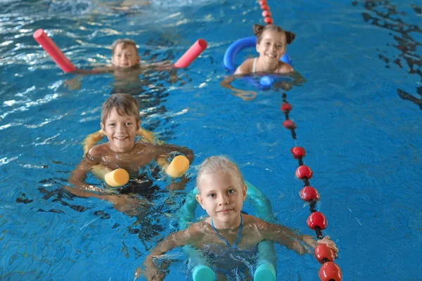 Little Kids Swimming Noodles Indoor Pool — Stock Photo, Image