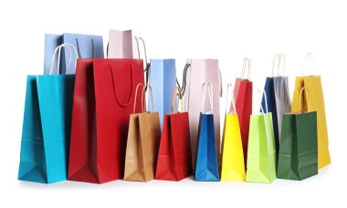 Colorful paper shopping bags on white background clipart