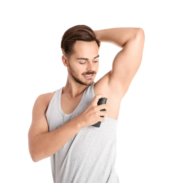 Beyaz Arka Plan Üzerinde Deodorant Kullanan Genç Adam — Stok fotoğraf