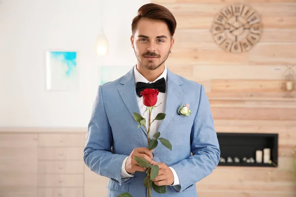 Handsome Man Formal Wear Holding Red Rose Indoors — Stock Photo, Image