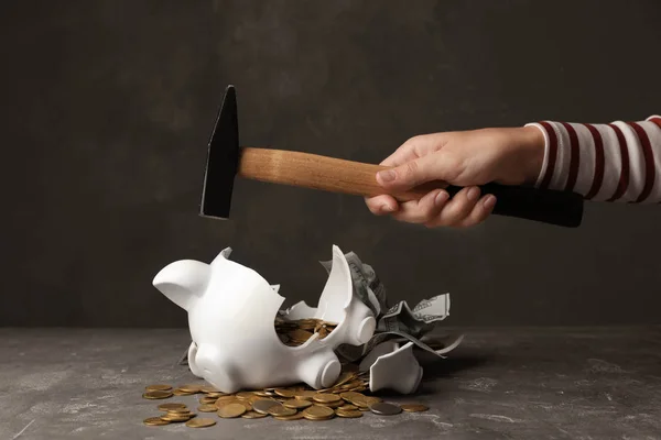 Woman Breaking Piggy Bank Hammer Table — Stock Photo, Image