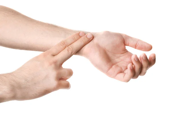 Mann Überprüft Puls Handgelenk Vor Weißem Hintergrund Nahaufnahme — Stockfoto