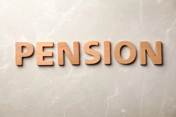 Ordet Pension Gjort Trä Bokstäver Grå Bakgrund — Stockfoto