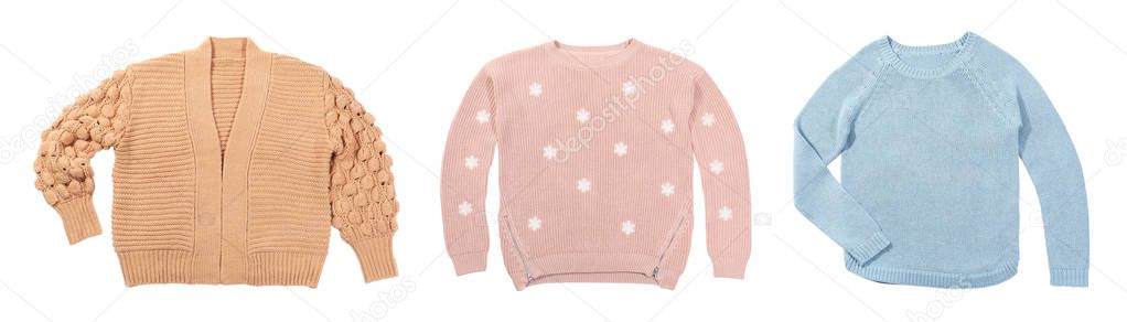 Set of cozy warm sweaters on white background