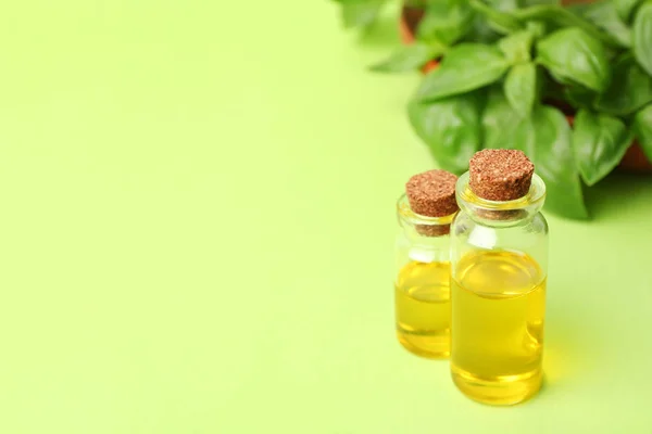 Bottles Basil Oil Leaves Space Text Color Background — Stock Photo, Image