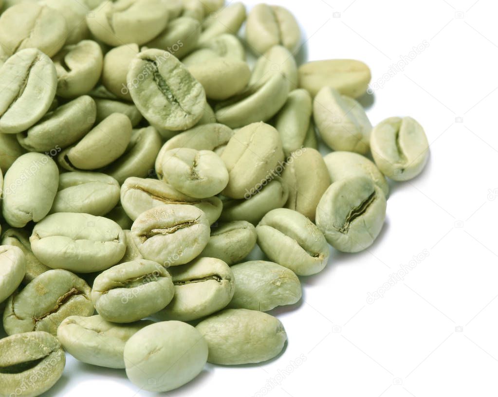 Green coffee beans on white background, closeup