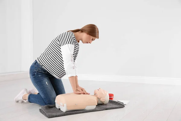 Woman Practicing First Aid Mannequin Indoors — Stock Photo, Image