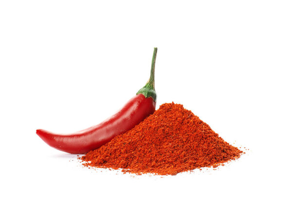 Fresh chili pepper and powder on white background