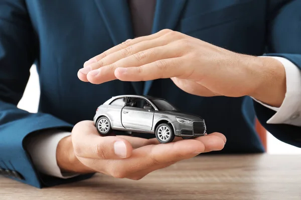 Insurance Agent Holding Toy Car Table Focus Hands — Stock Photo, Image