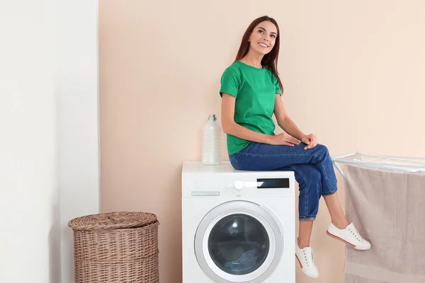 Young Woman Sitting Washing Machine Home Space Text Laundry Day — Stock Photo, Image