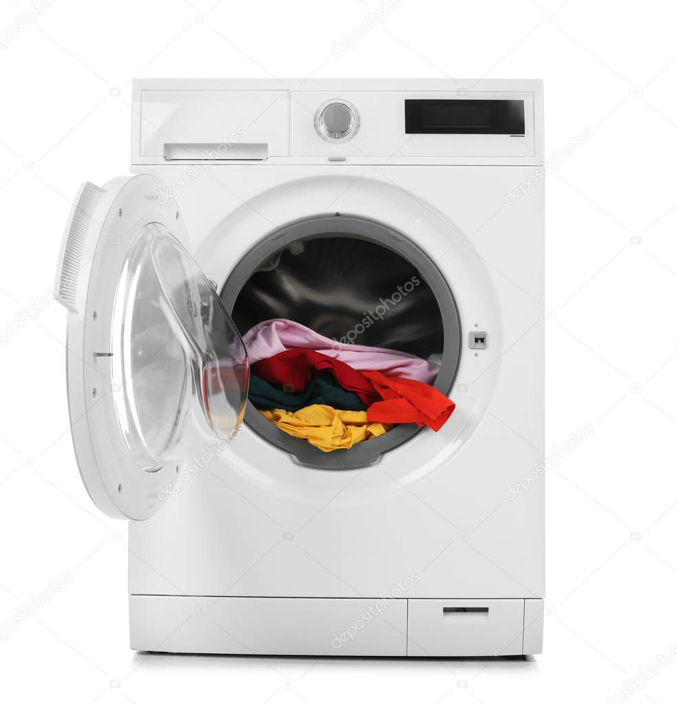 Modern washing machine with laundry on white background