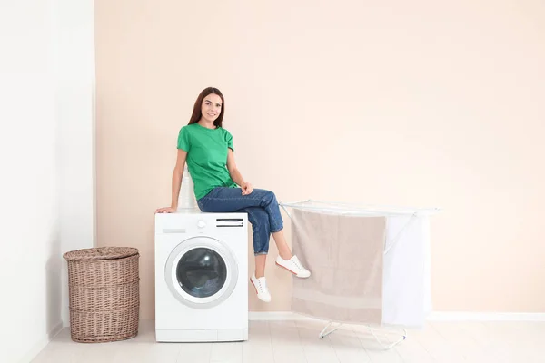 Young Woman Sitting Washing Machine Home Space Text Laundry Day — Stock Photo, Image