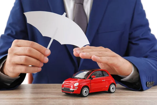 Insurance Agent Covering Toy Car Paper Cutout Umbrella Hand Table — Stock Photo, Image