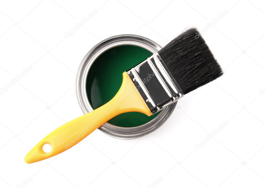 Paint can with brush on white background, top view