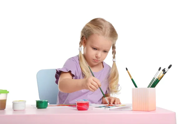 白い背景の上のテーブルで絵を描いているかわいい子 — ストック写真