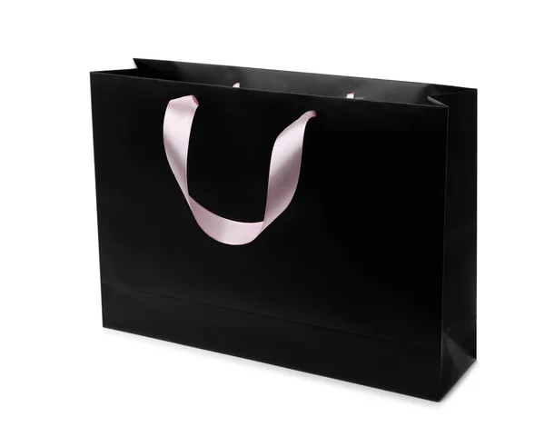 リボン付きペーパー ショッピング バッグは 白い背景の上処理します デザインのモックアップ — ストック写真
